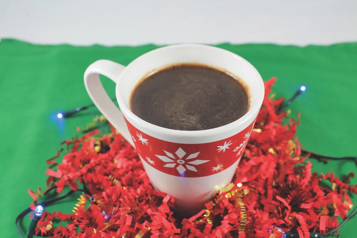 Hot cocoa served in festive mug.