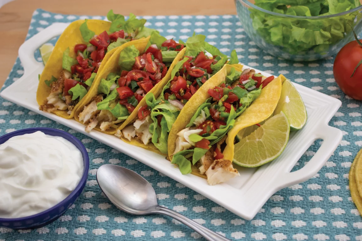 Tacos plates with fish lime and cilantro
