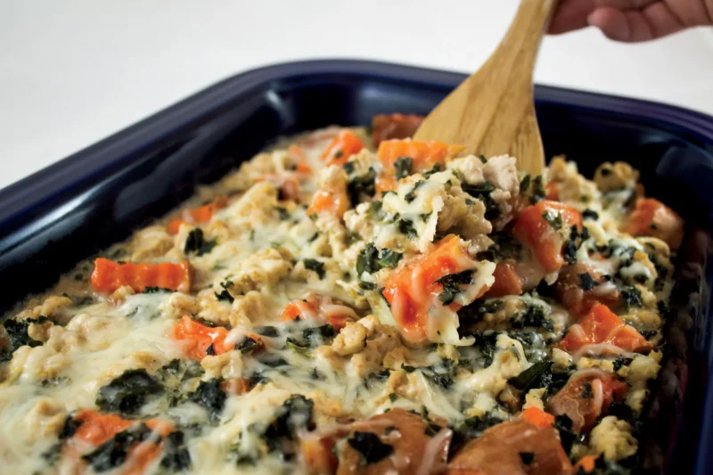 sweet potato turkey bake being served out of casserole dish