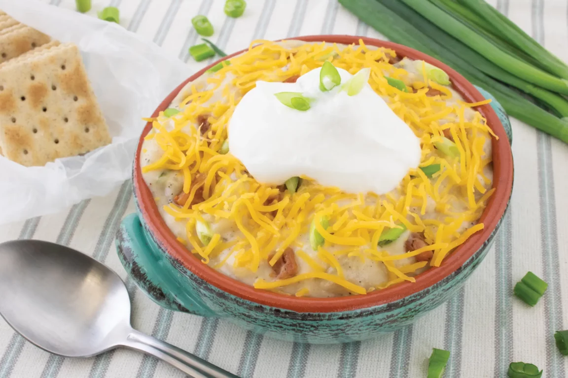 Loaded baked potato soup topped with cheese