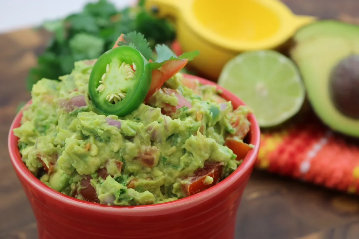 Chunky guacamole topped with cilantro 