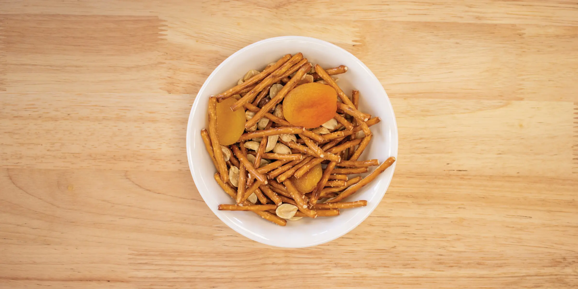 Apricot pretzel snack mix in a bowl