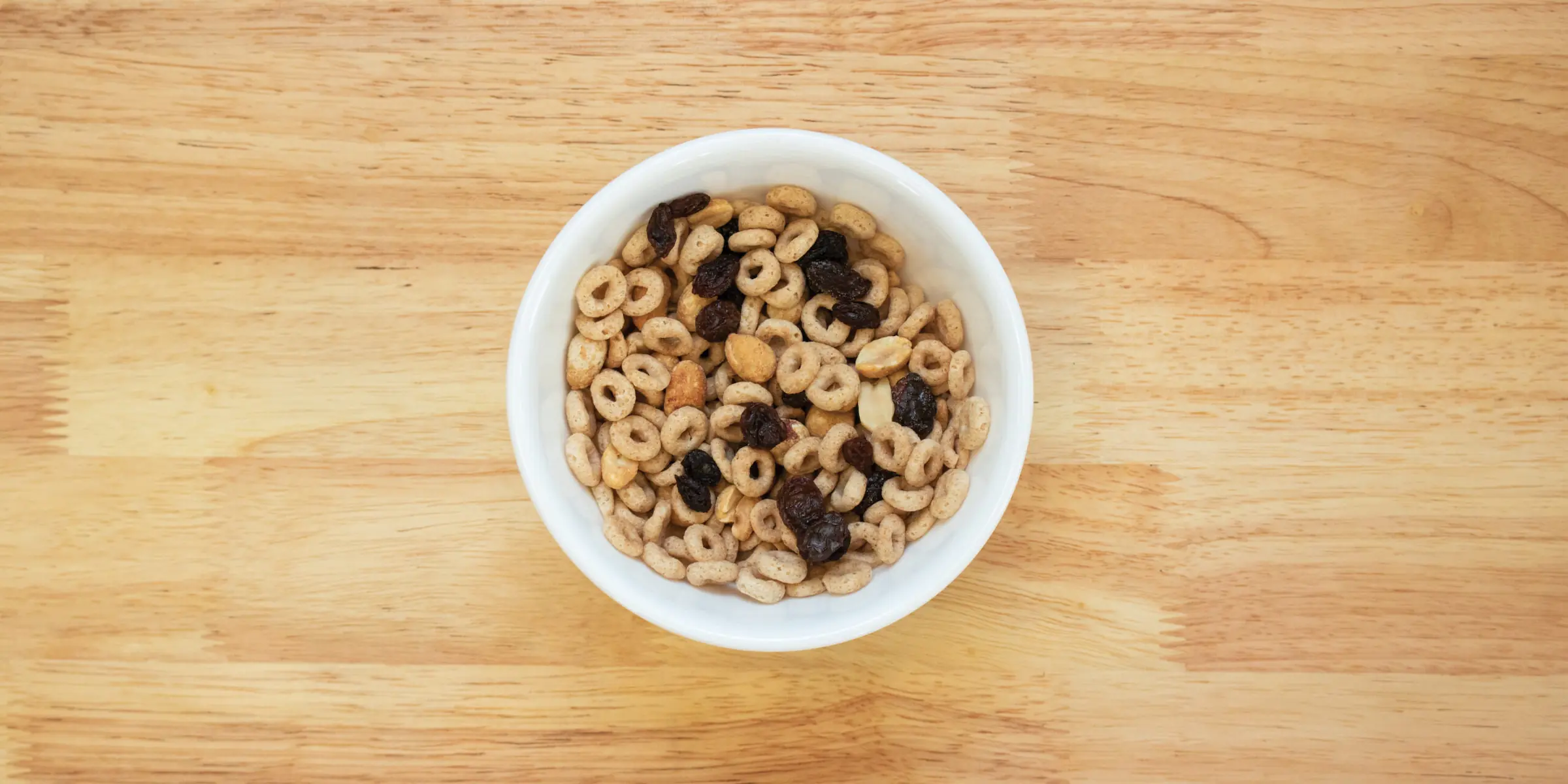 Peanut raisin snack mix in a bowl