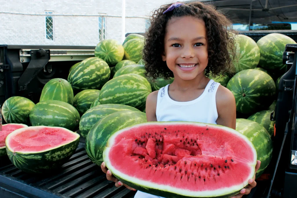 girl holding watermelon.